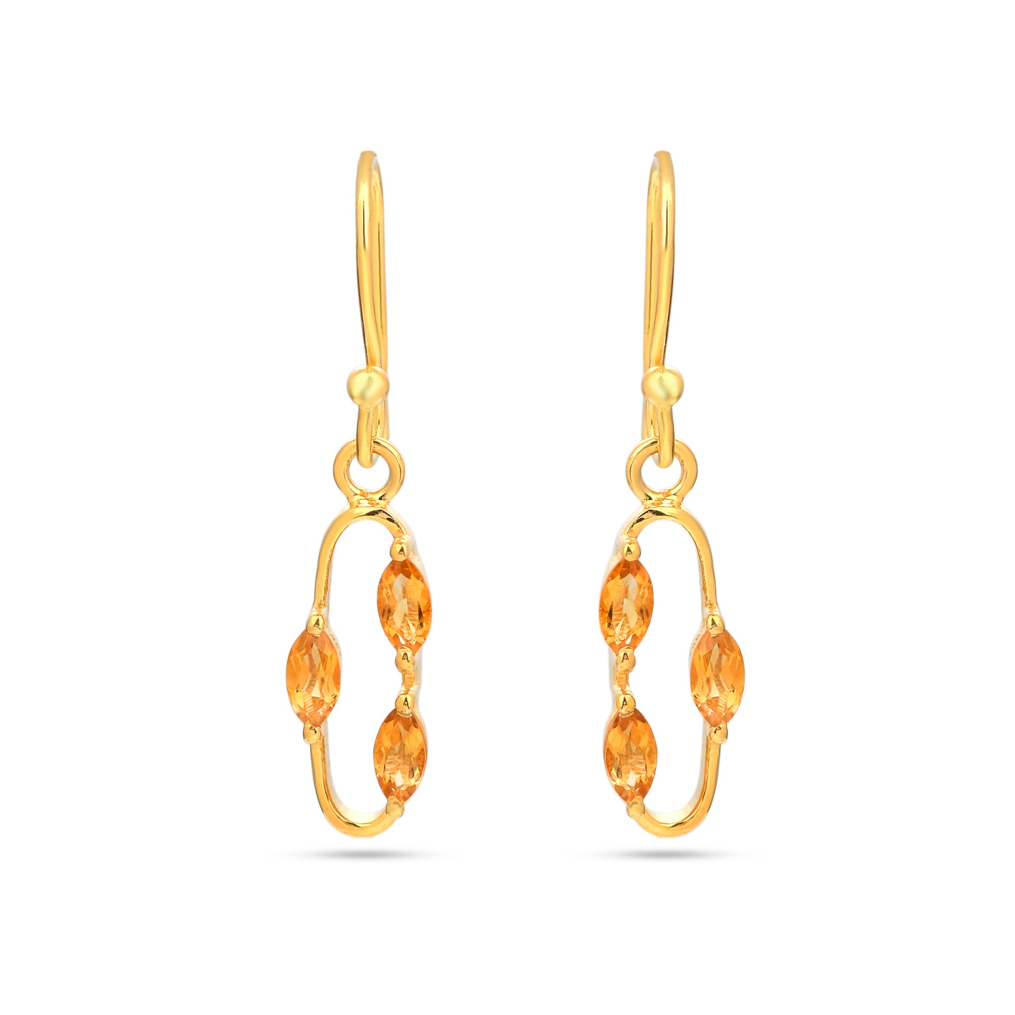 Gold earrings with orange gemstones on a white background