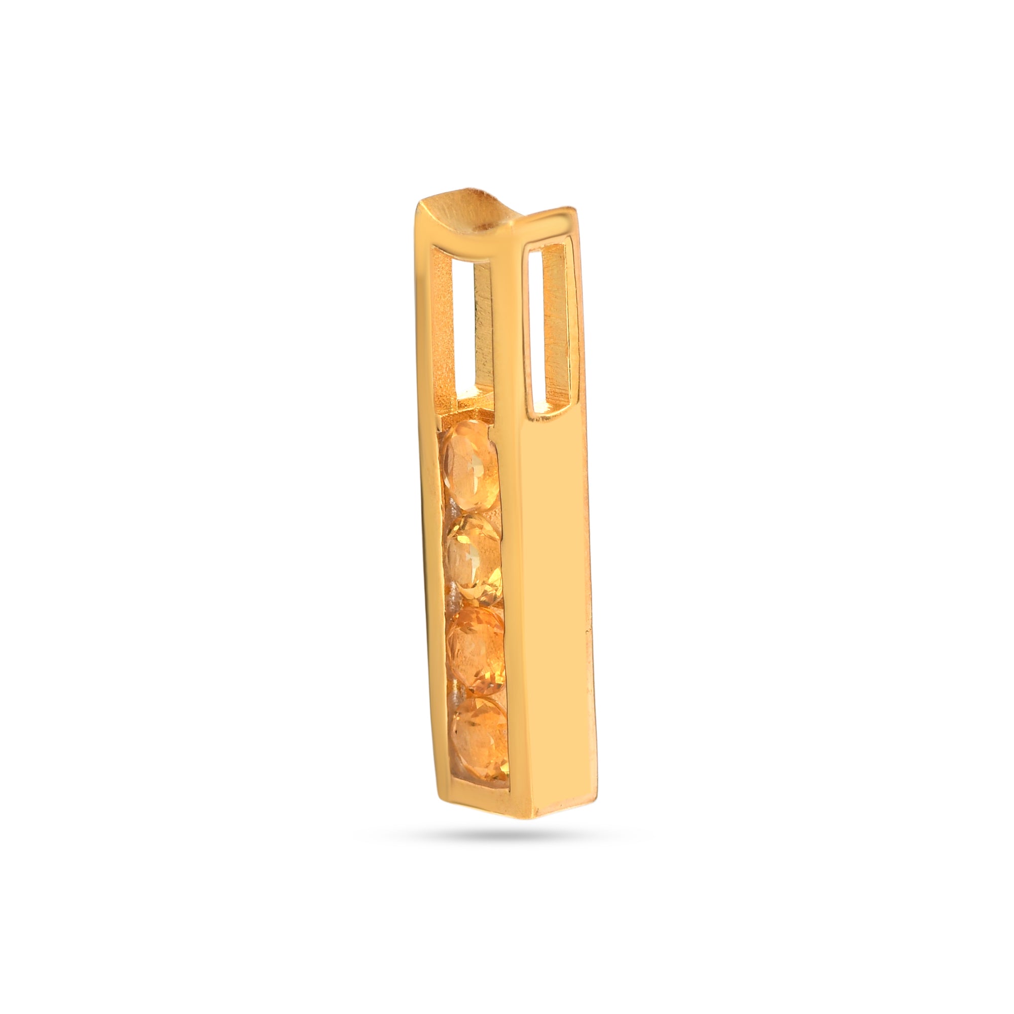 Gold earring with a central gemstone on a white background