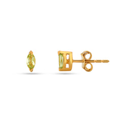 Gold earrings with green gemstones on a white background