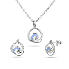 Silver jewelry set with spiral design on a white background