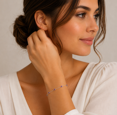 Woman adjusting an earring with a subtle background