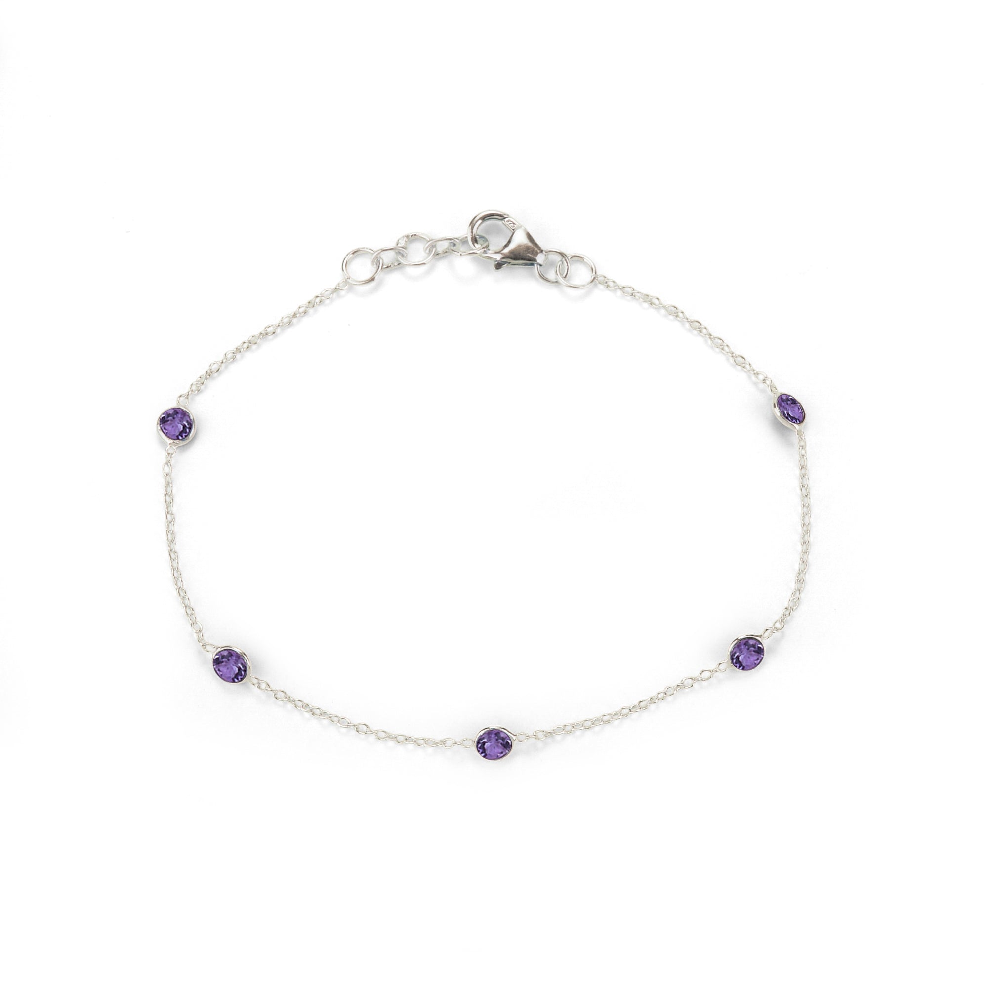 Silver bracelet with purple gemstones on a white background