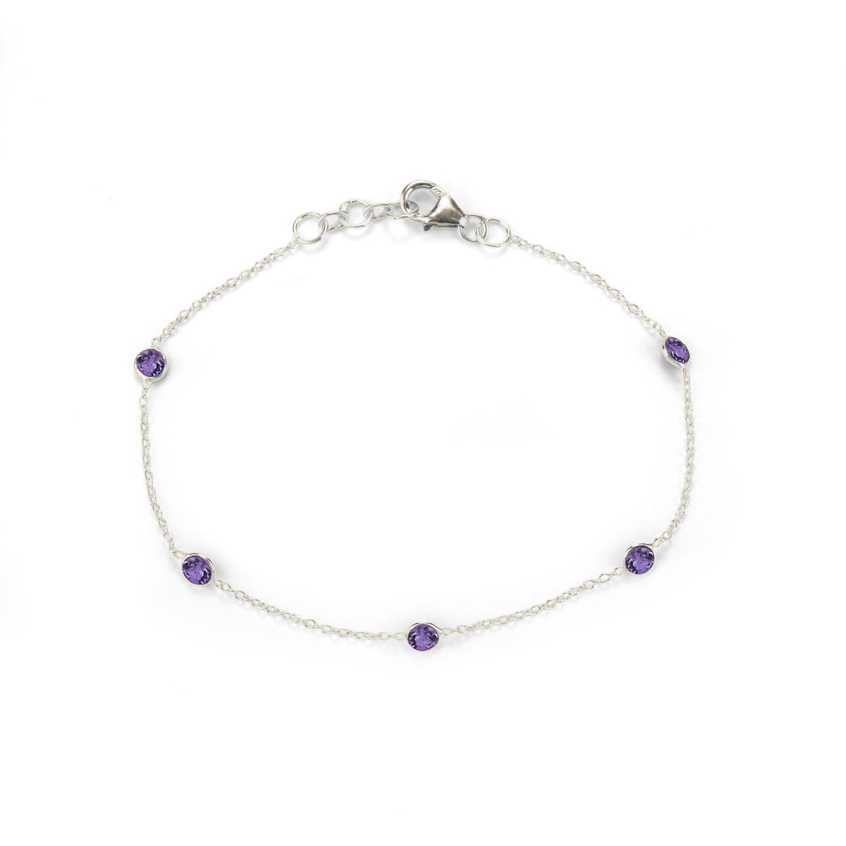 Silver bracelet with purple gemstones on a white background