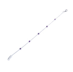 Silver bracelet with purple beads on a white background