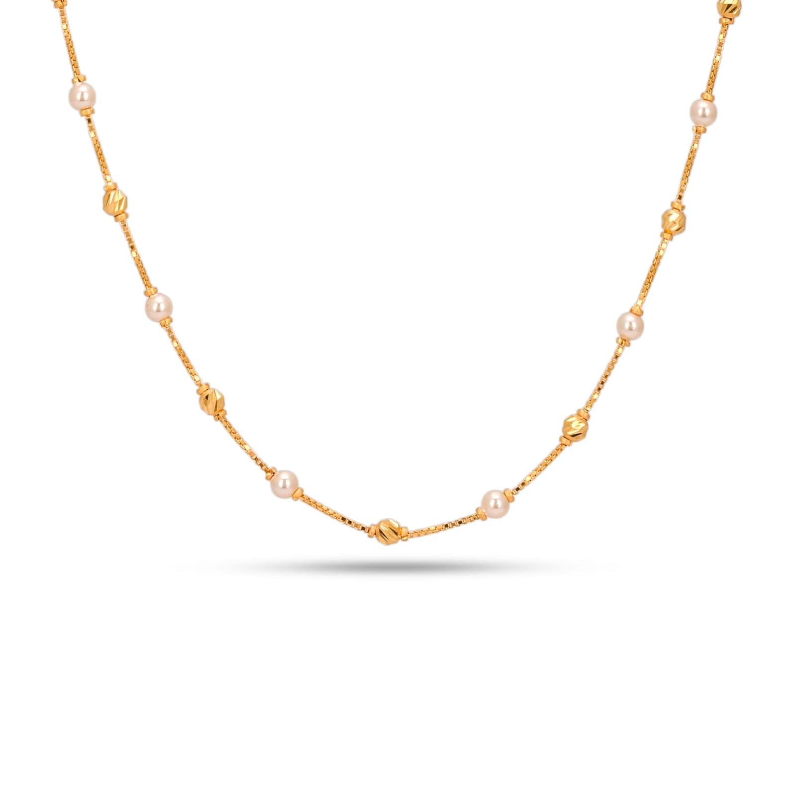 Gold necklace with pearls on a white background