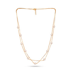 Gold necklace with pearls on a white background