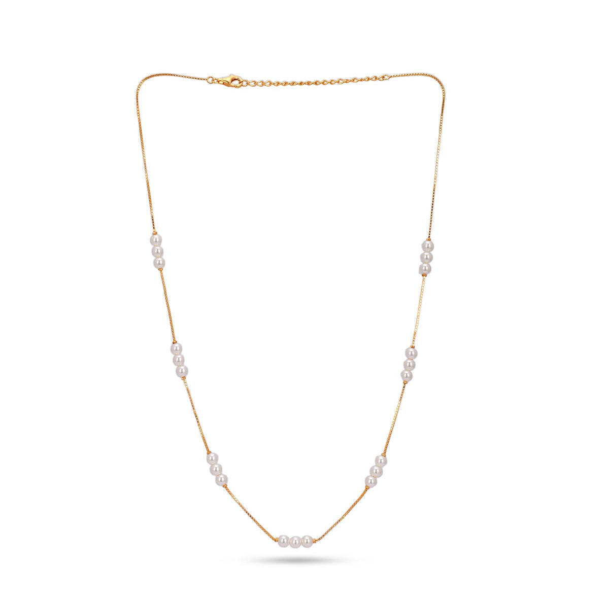 Gold necklace with pearls on a white background