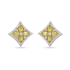 Pair of diamond and peridot earrings on a white background