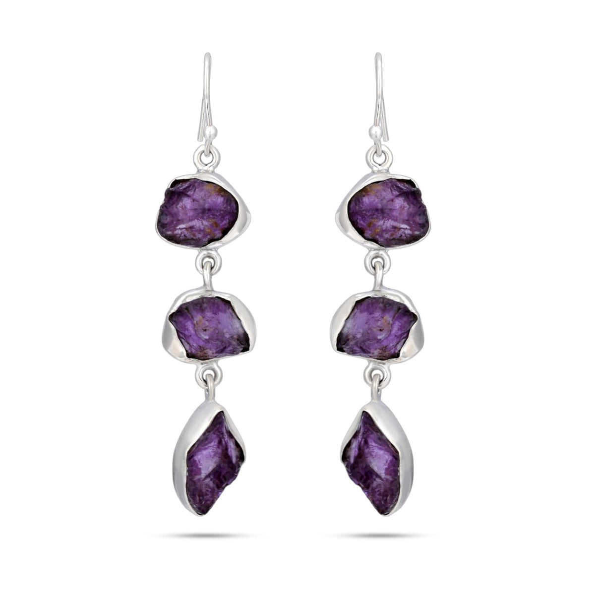 Pair of silver earrings with purple gemstones on a white background