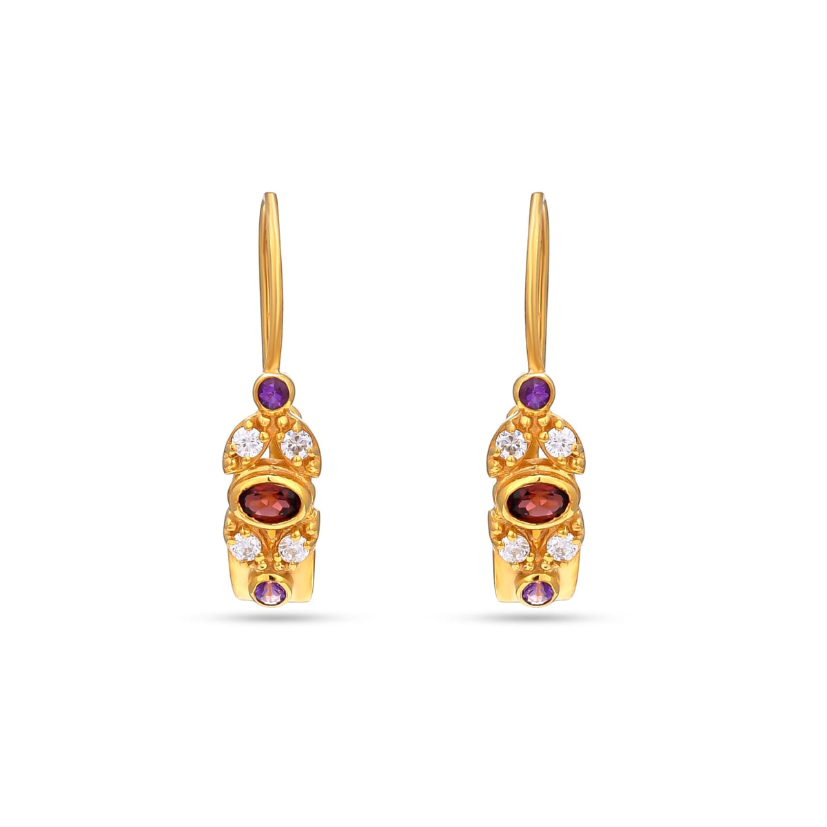 Gold earrings with gemstones on a white background