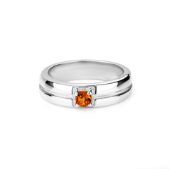 Silver ring with a small orange gemstone on a white background