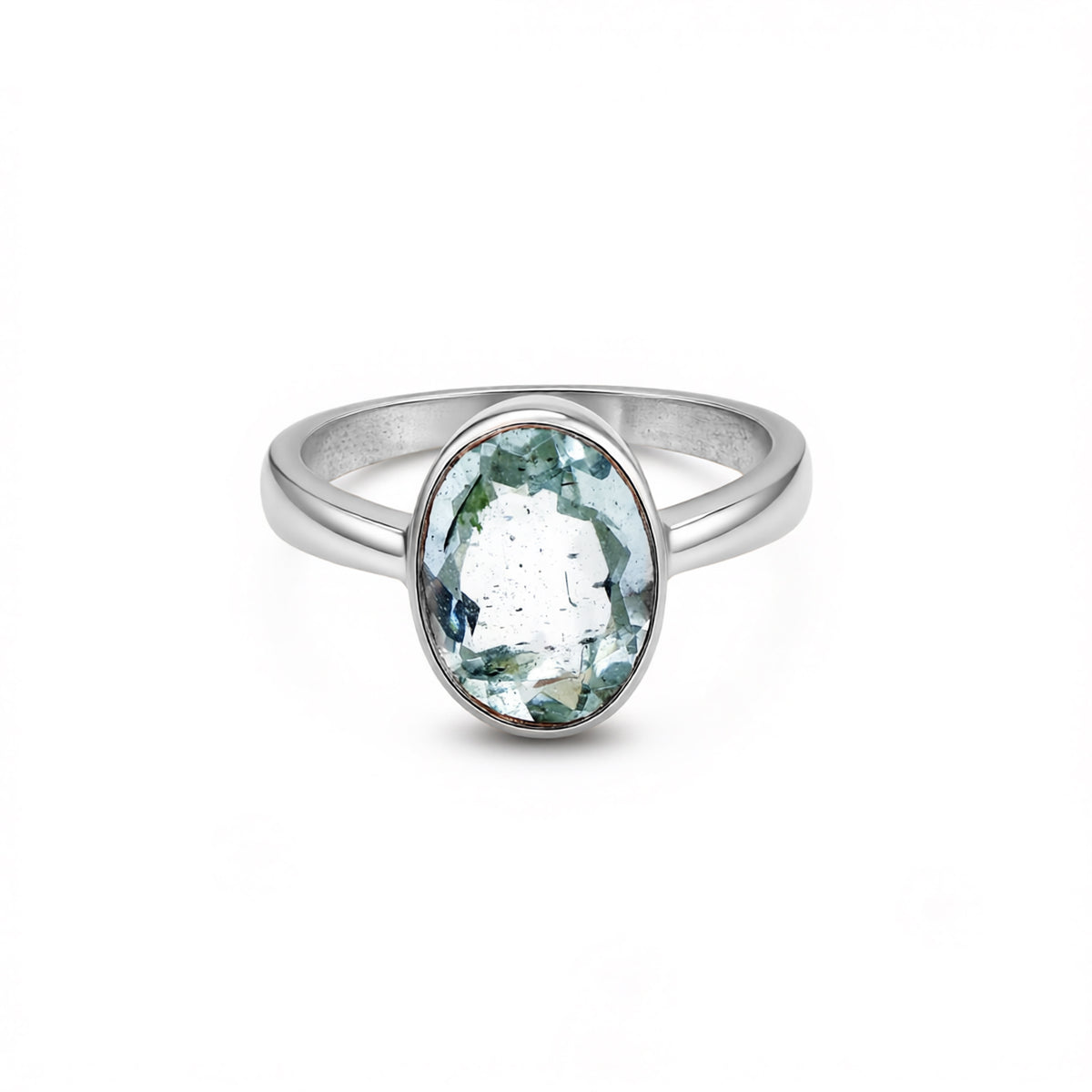 Silver ring with a green gemstone on a white background