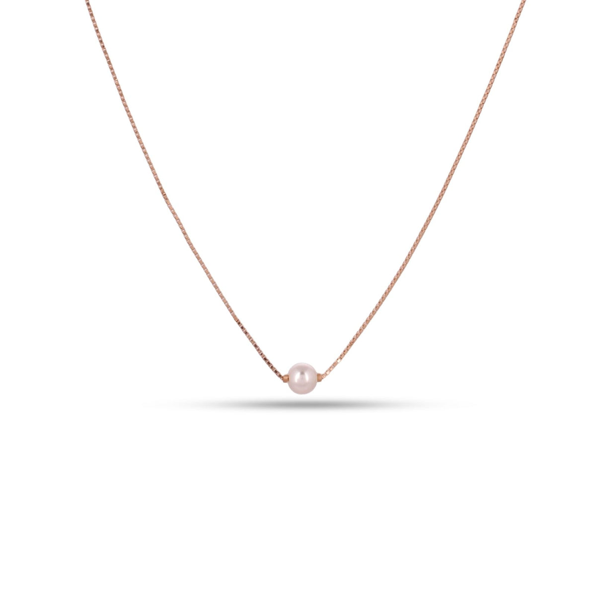 Necklace with a single pearl on a white background