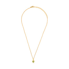 Gold necklace with a green heart pendant on a white background