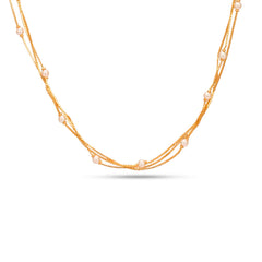 Gold necklace with pearls on a white background