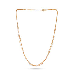 Gold necklace with small pearls on a white background