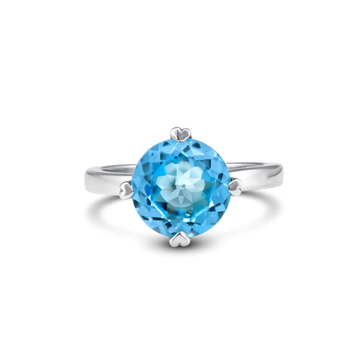 Silver ring with a blue gemstone on a white background